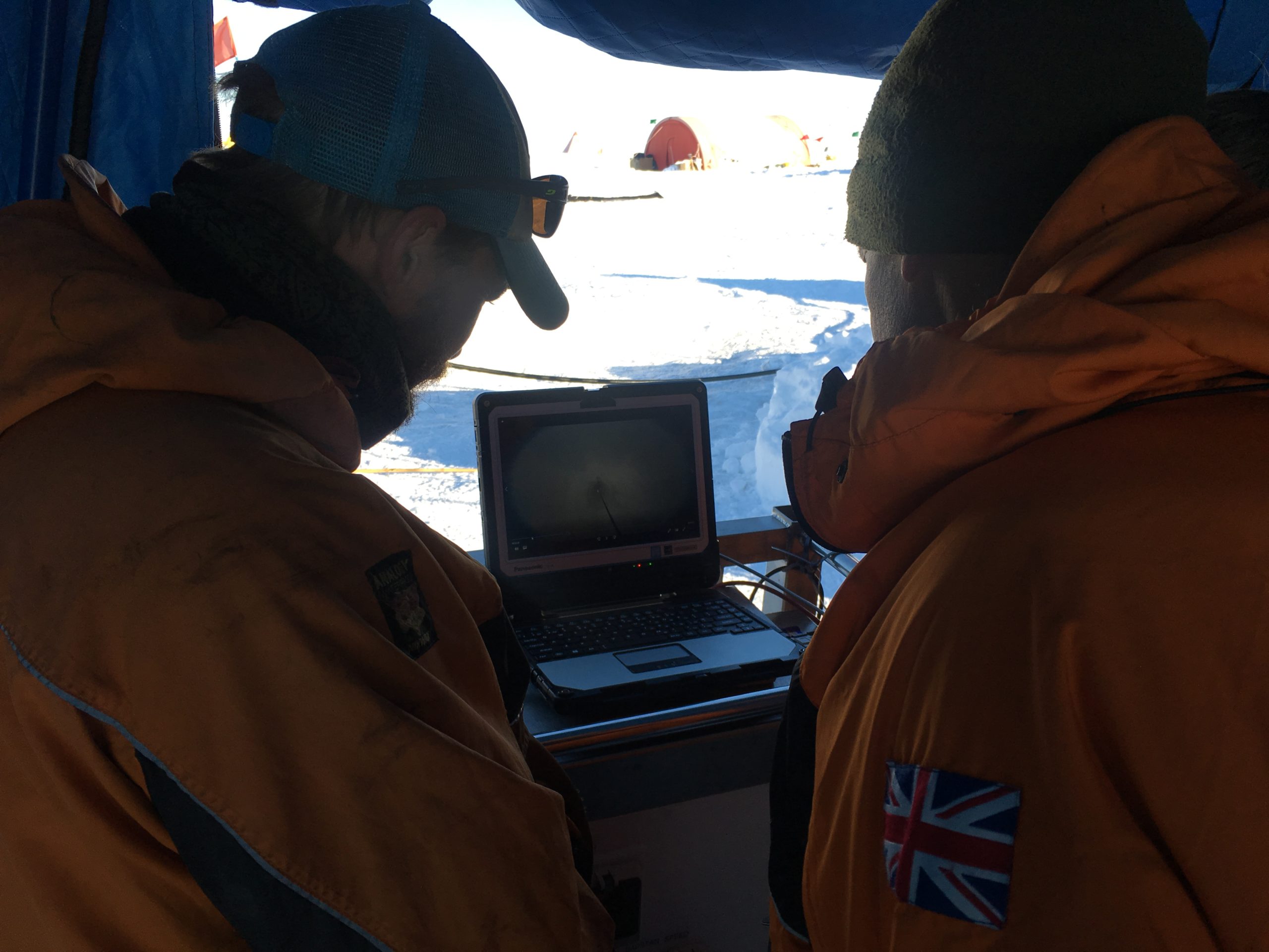Paul Anker, BAS lead hot water driller and Keith Nicholls, BAS view GoPro footage of the newly bored hole in Thwaites Glacier.